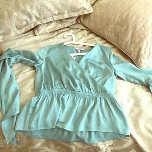 Express wrap top with bell sleeves